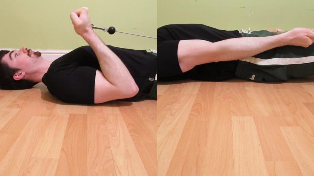 A man performing lying cable curls for his biceps