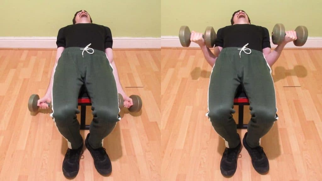 A man doing dumbbell lying curls in a supine position for his biceps