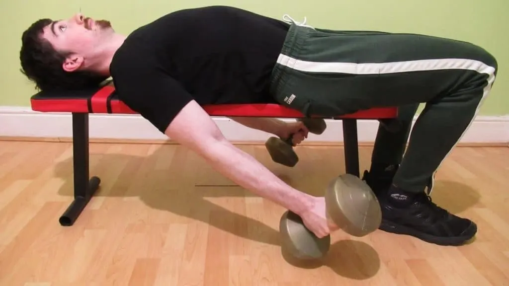 A man doing a lying dumbbell hammer curl