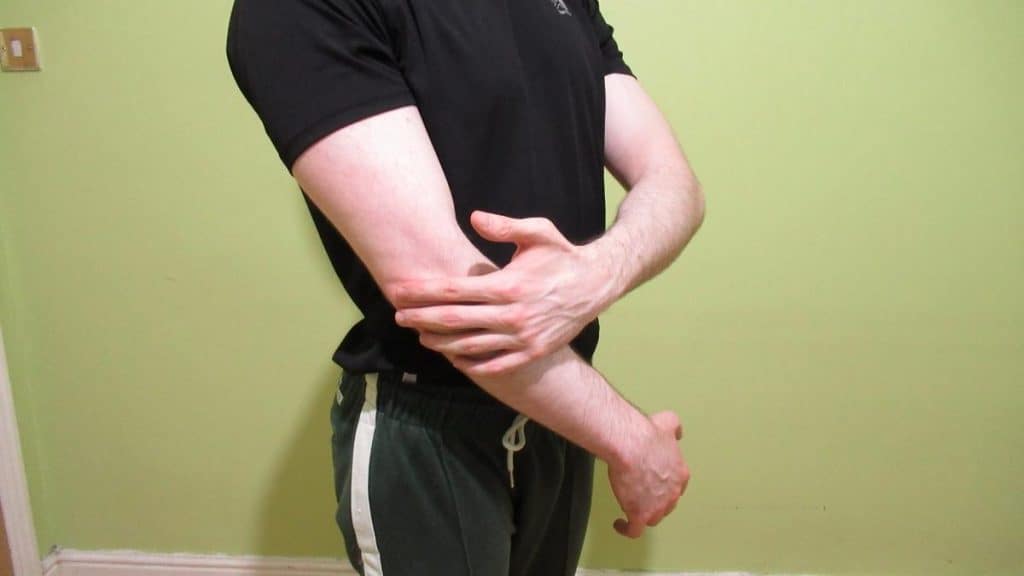 A man holding his elbow