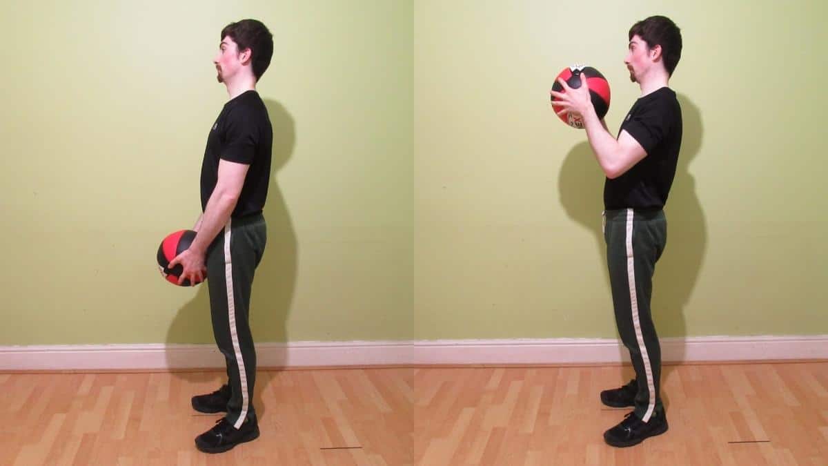 A man doing medicine ball curls for his biceps