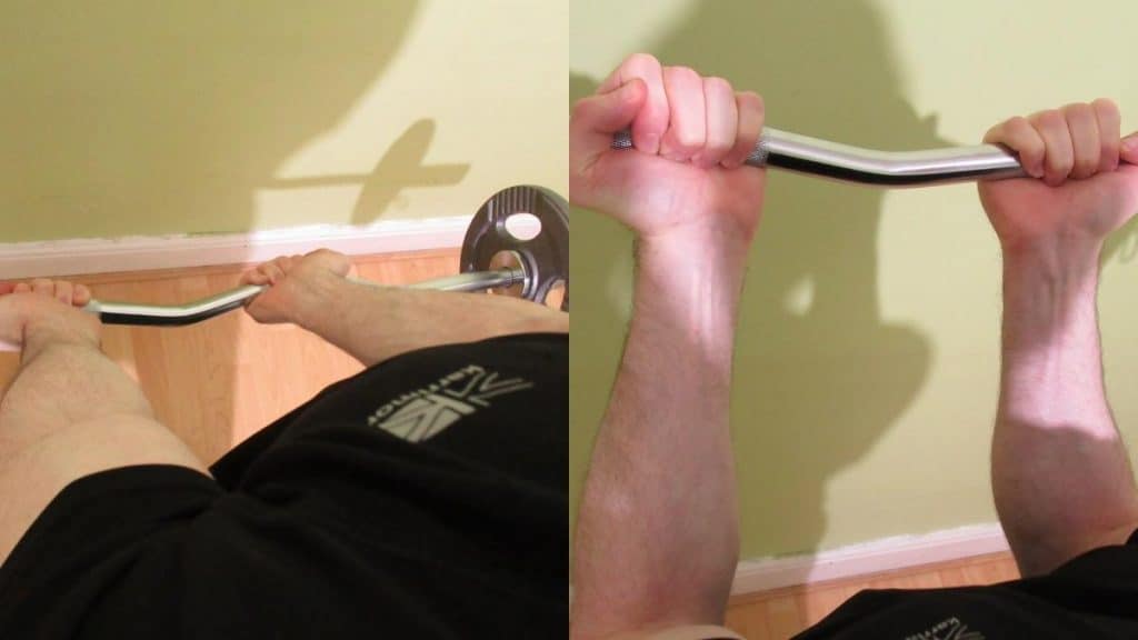 A man doing a narrow grip EZ bar curl to work his biceps