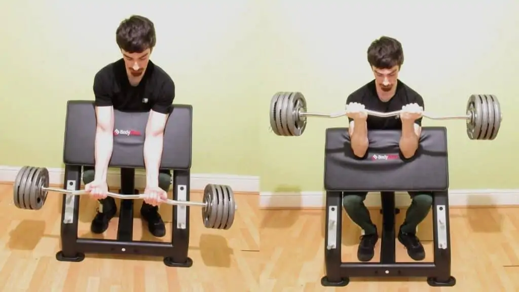 A man performing a narrow grip preacher curl to work his biceps