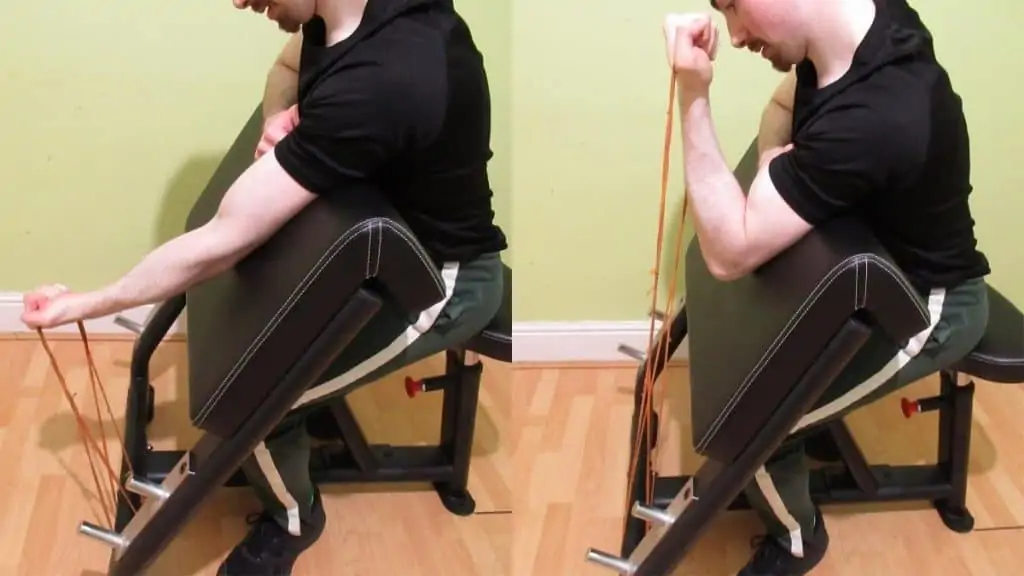 A man doing a one arm band preacher curl with a single resistance band