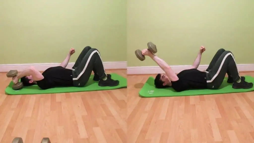 A man doing a one arm dumbbell floor skull crusher