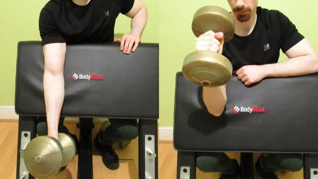 A man doing a one arm preacher hammer dumbbell curl