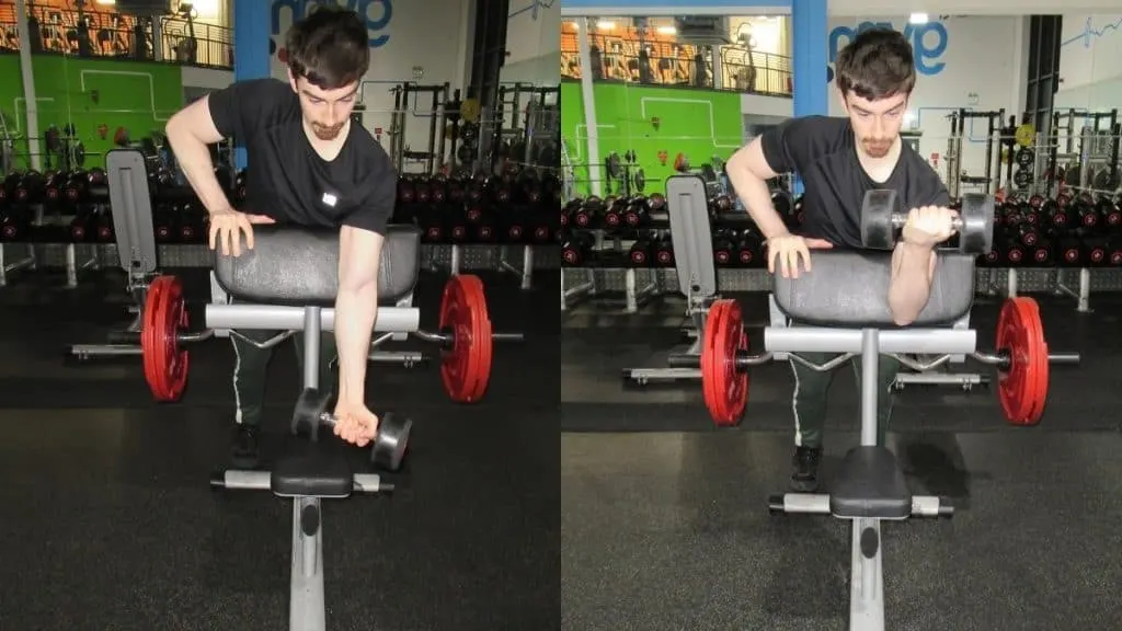 A man doing a one arm spider curl at the gym