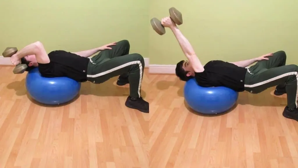 A man doing a one arm Swiss ball triceps extension with a single dumbbell