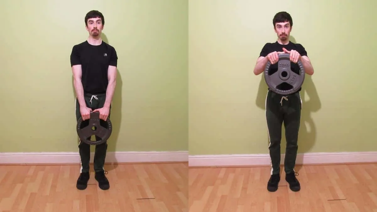 A man performing a weight plate reverse curl for his biceps