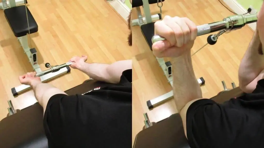 A man doing a preacher curl on the cable machine