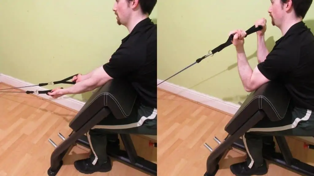 A man performing preacher curls with bands