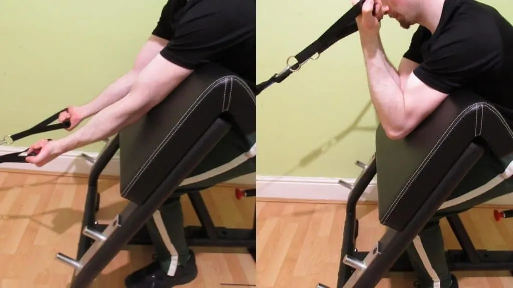 A man doing preacher curls with resistance bands