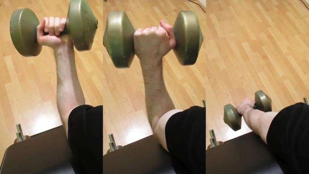 A man doing a preacher Zottman curl with a dumbbell