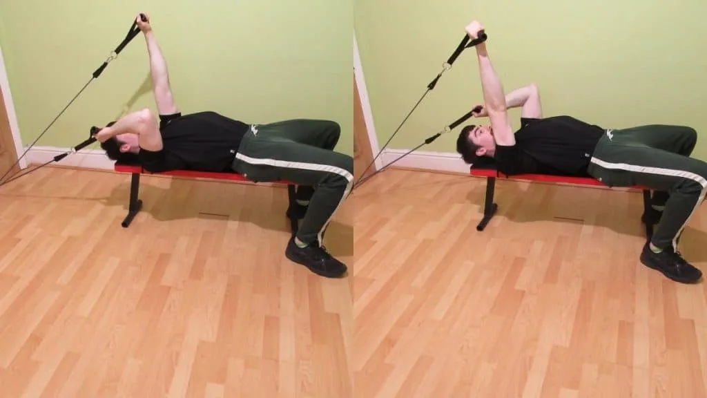 A man performing a resistance band alternating skullcrusher