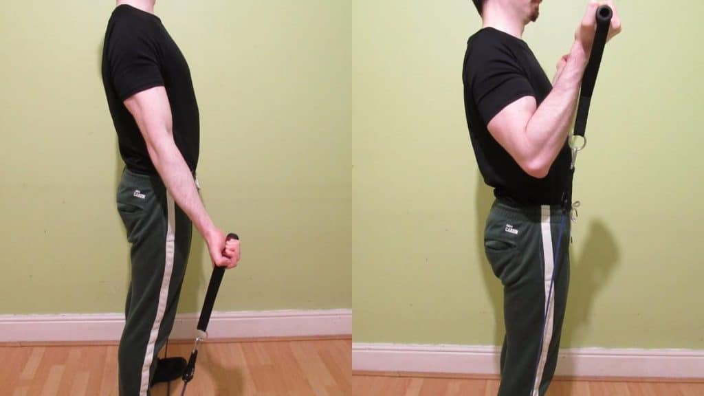 A man doing a resistance band bicep curl with good form