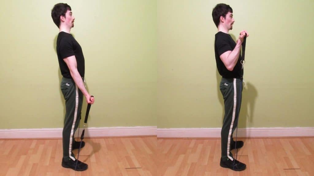 A man performing standing resistance band bicep curls
