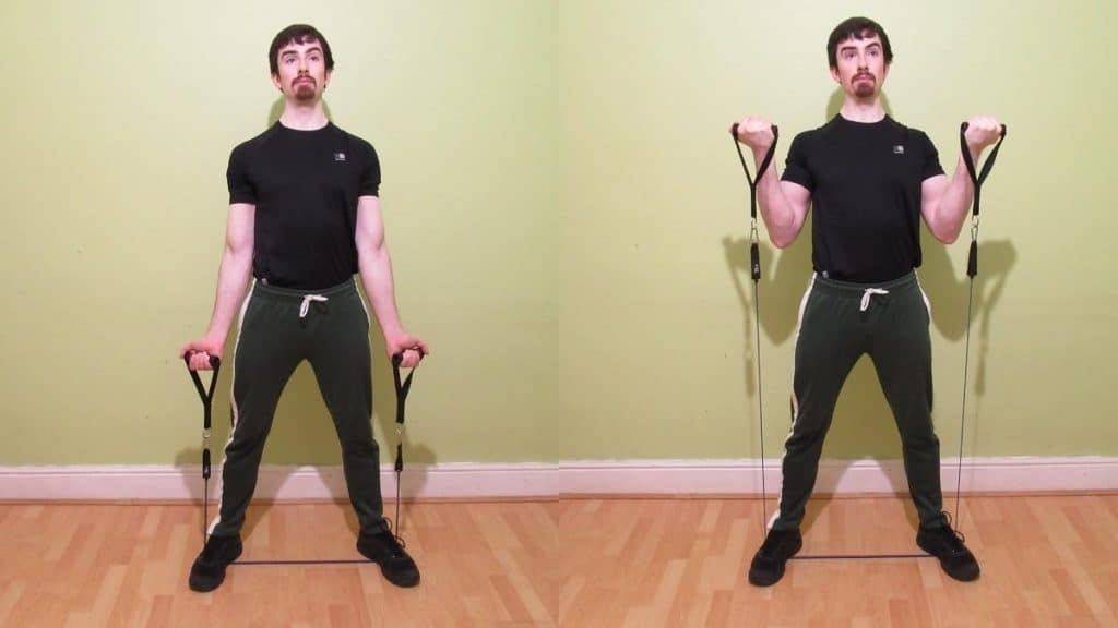 A man performing resistance band curls for his biceps