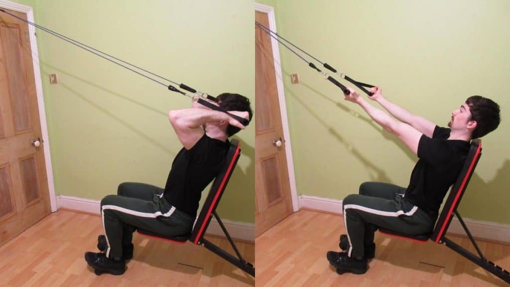 A man doing resistance band incline curls for his biceps