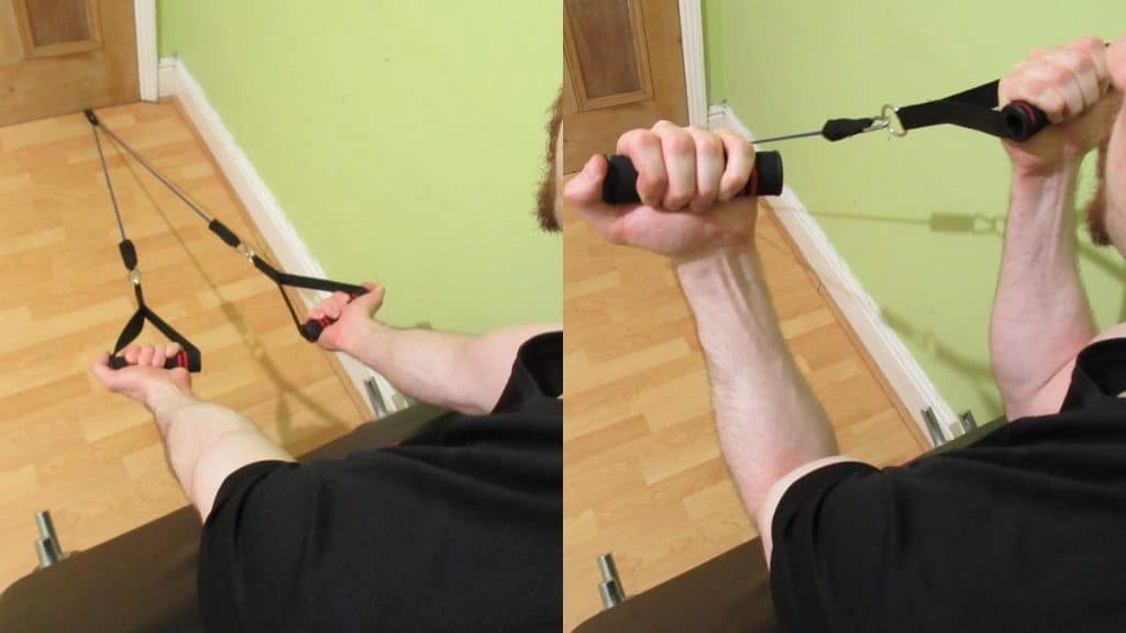 A man performing a resistance band preacher curl to work his biceps