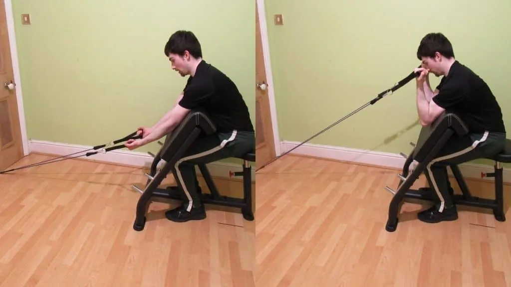 A man doing resistance band preacher curls for his biceps