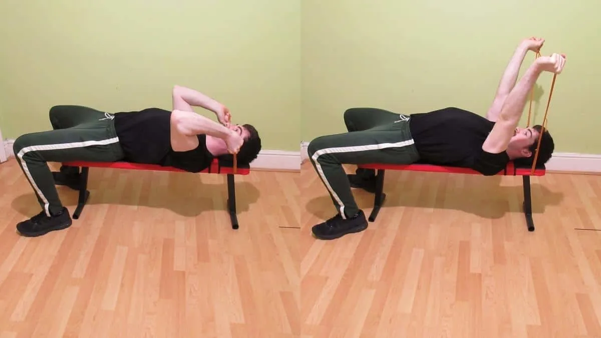 A man doing a resistance band skull crusher for his triceps