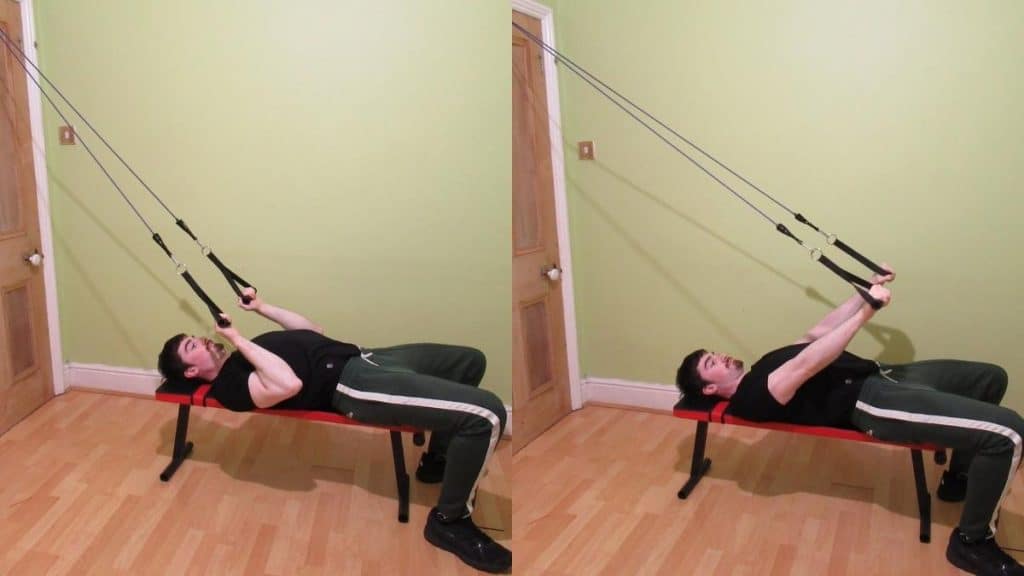 A man performing resistance band skull crushers for his triceps
