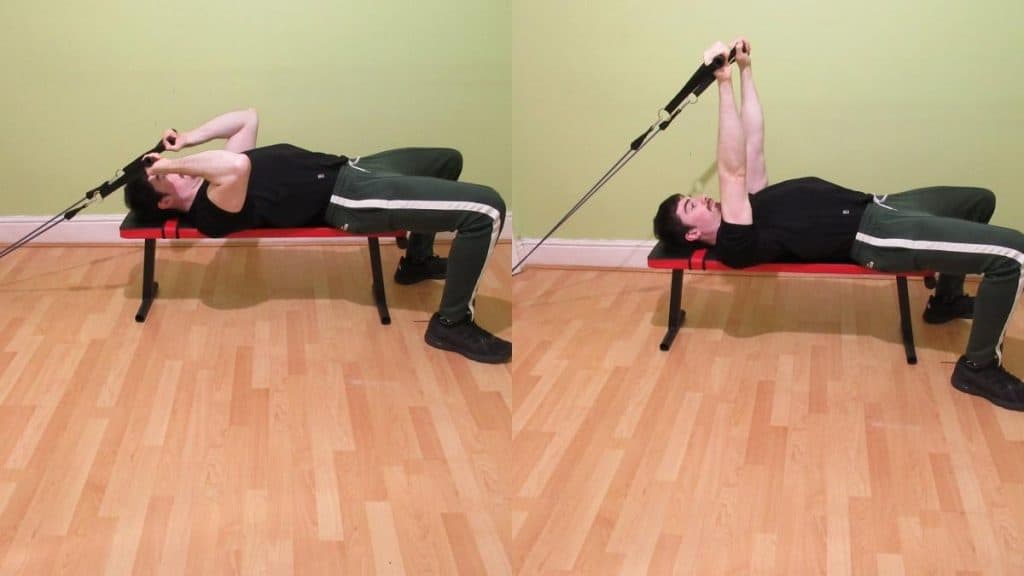 A man performing a resistance band skullcrusher