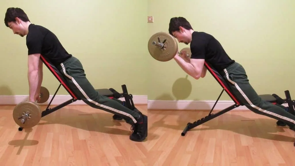 A man performing a reverse barbell spider curl