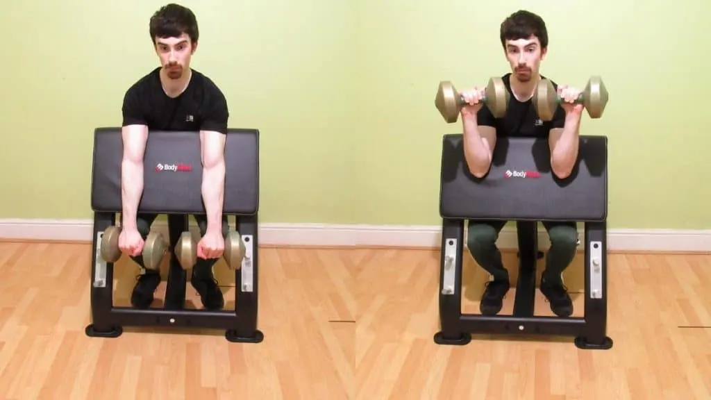 A man performing a reverse dumbbell preacher curl