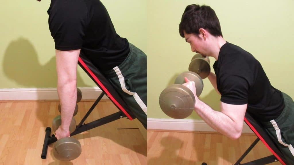 A man doing a reverse dumbbell spider curl
