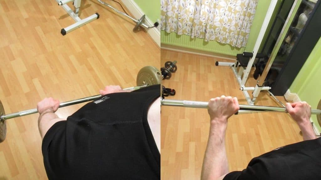 A man doing a reverse grip bicep curl with a barbell