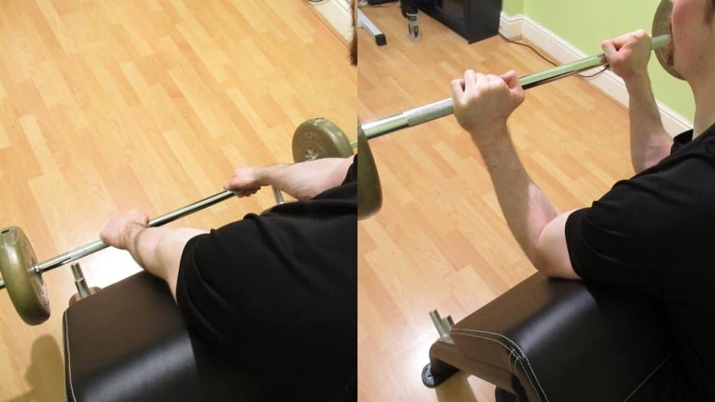 A man performing a reverse grip preacher curl for his biceps