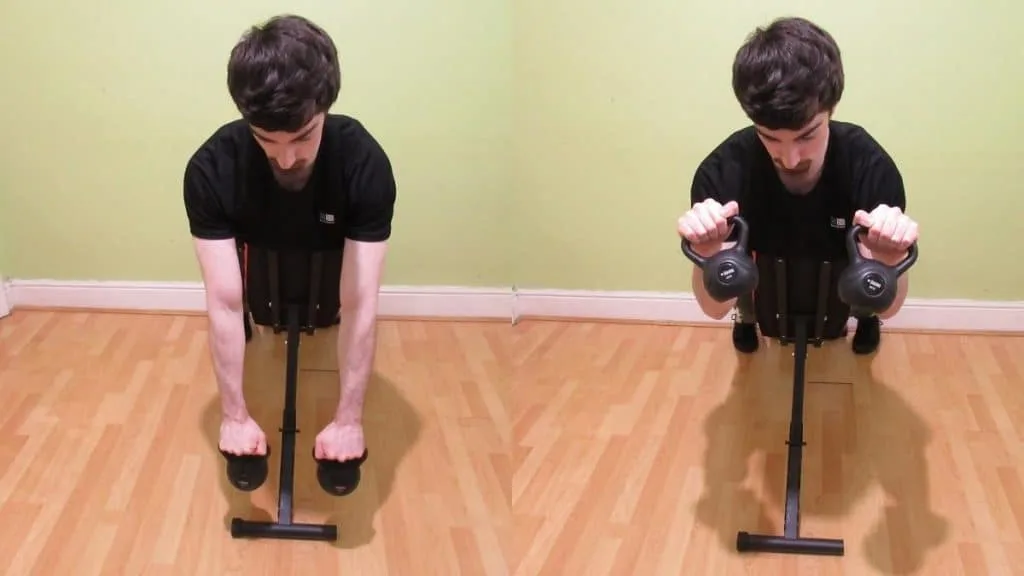 A man doing a reverse kettlebell spider curl