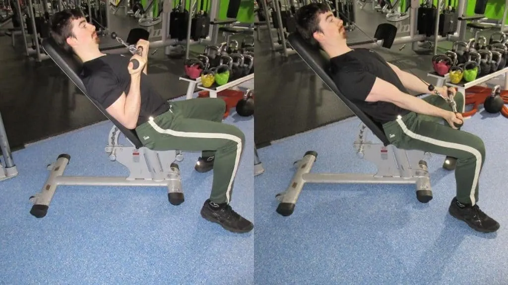 A man doing a reverse seated triceps pushdown