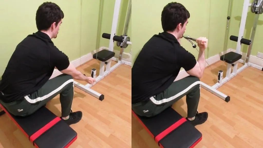 A man doing seated cable concentration curls