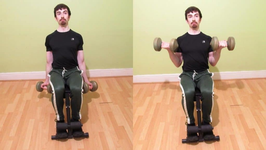 A man performing seated dumbbell curls for his biceps