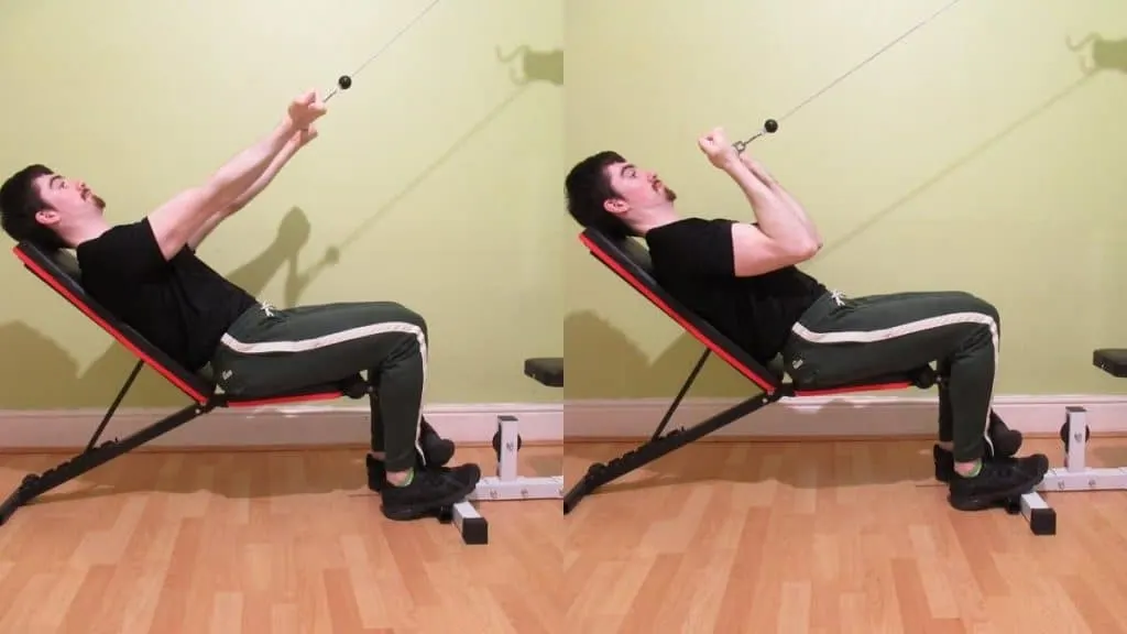 A man doing a seated incline cable curl for his biceps