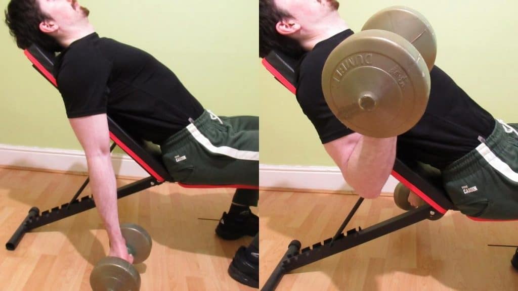 A man doing seated incline dumbbell curls for his biceps