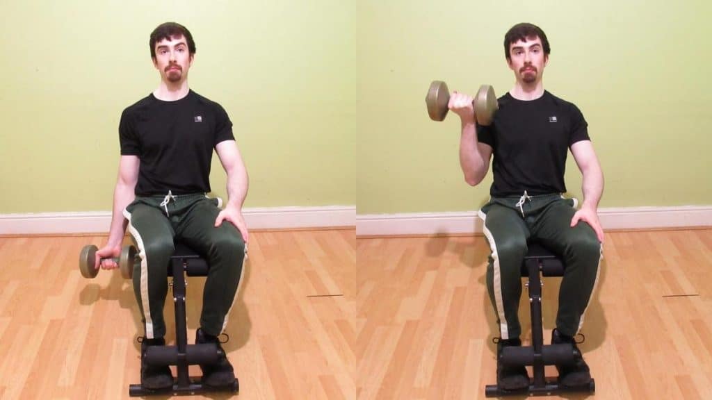 A man performing a seated one arm dumbbell curl