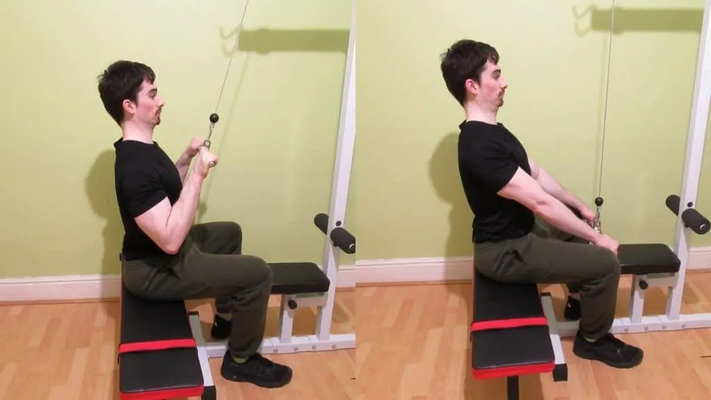 A man doing a seated straight bar pushdown