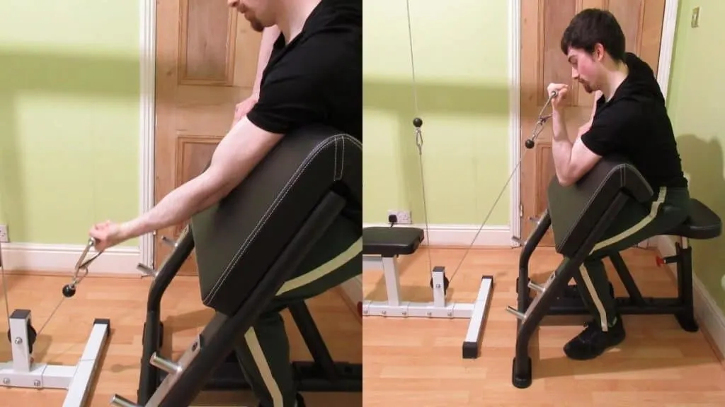 A man doing single arm preacher cable curls with one cable handle attachment