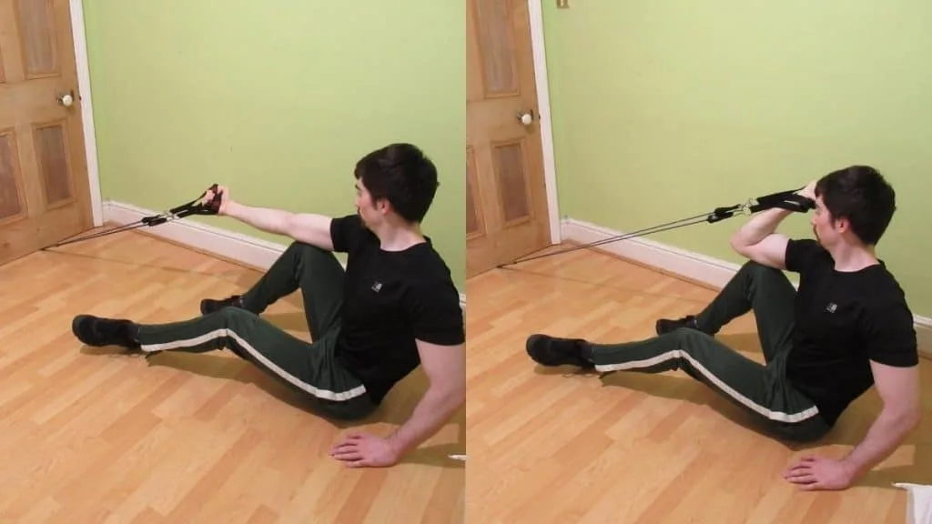 A man doing a single arm resistance band preacher curl