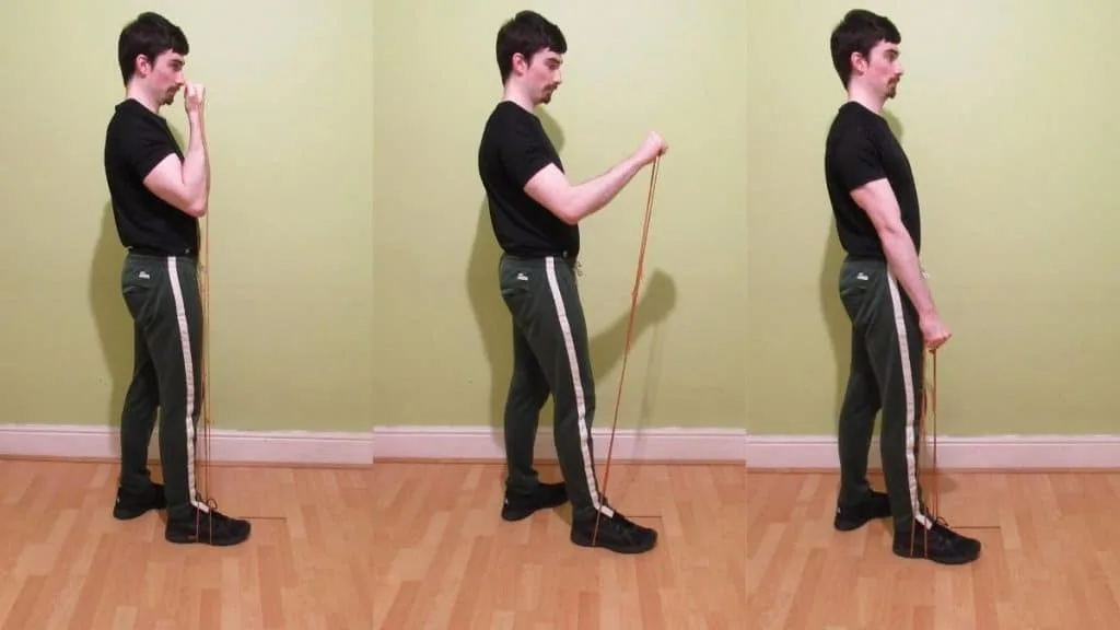 A man doing a single arm resistance band Zottman curl