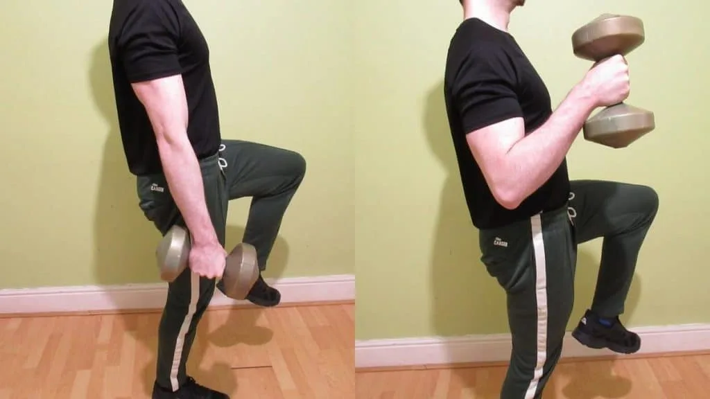 A man doing a single leg dumbbell hammer curl