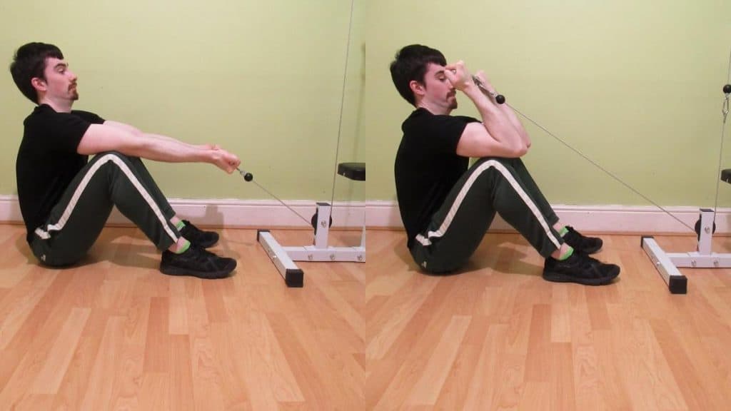 A man performing a sitting cable curl to work his biceps