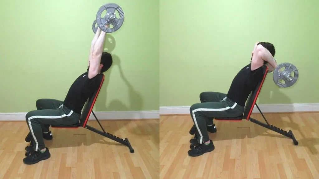 A man doing a sitting EZ bar French press