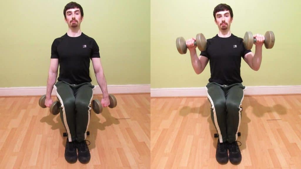 A man performing sitting reverse dumbbell curls