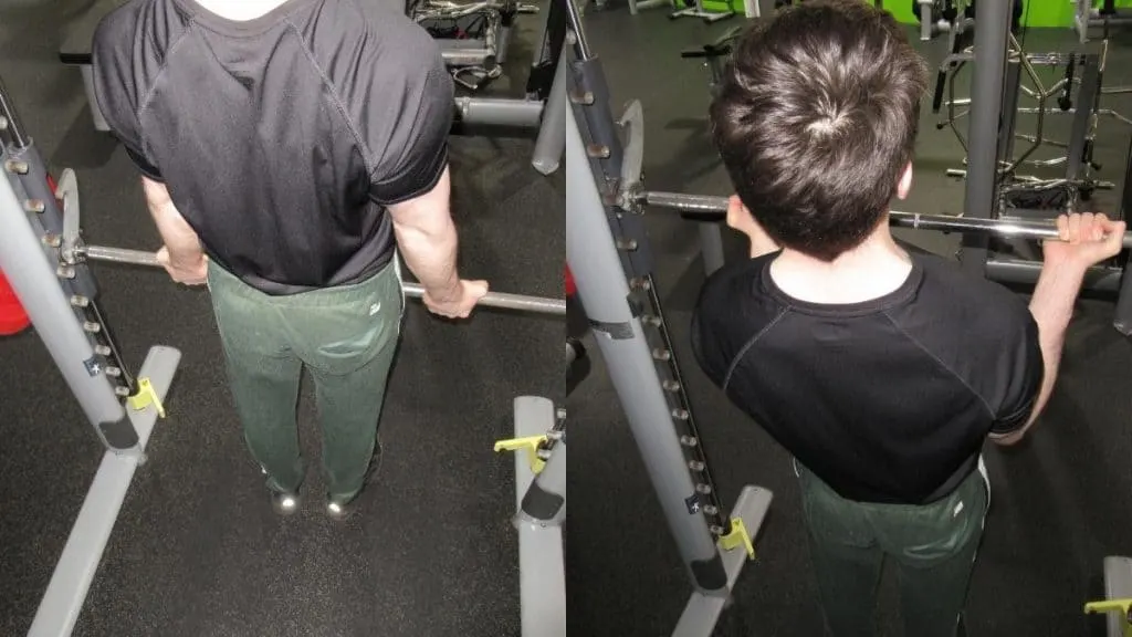 A man doing a Smith machine bicep curl