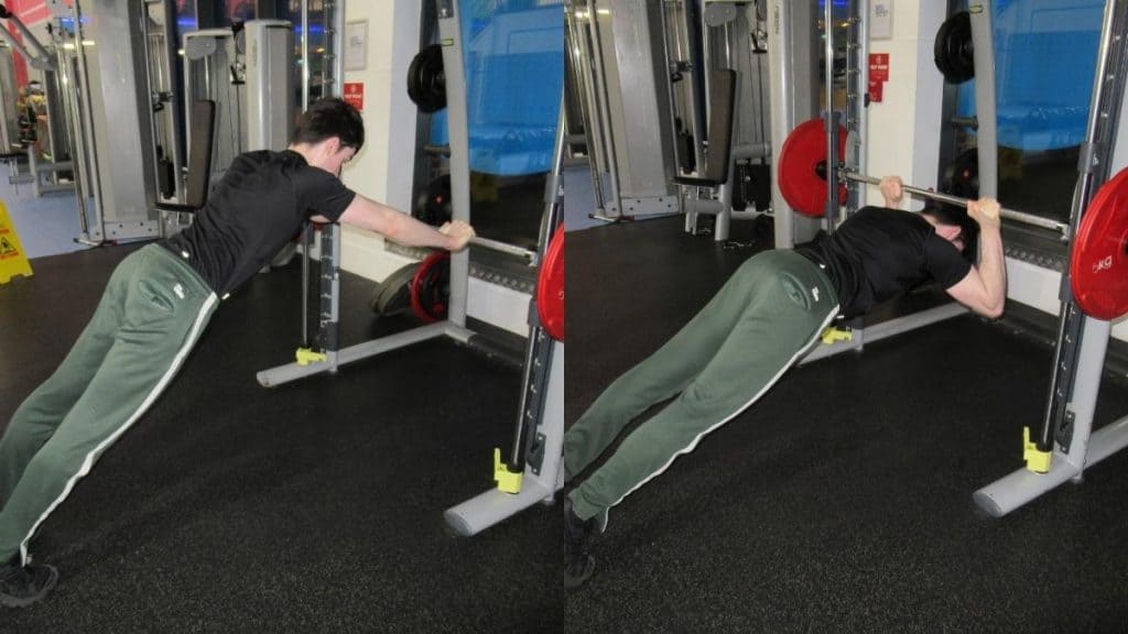 A man doing Smith machine body weight skull crushers for his triceps