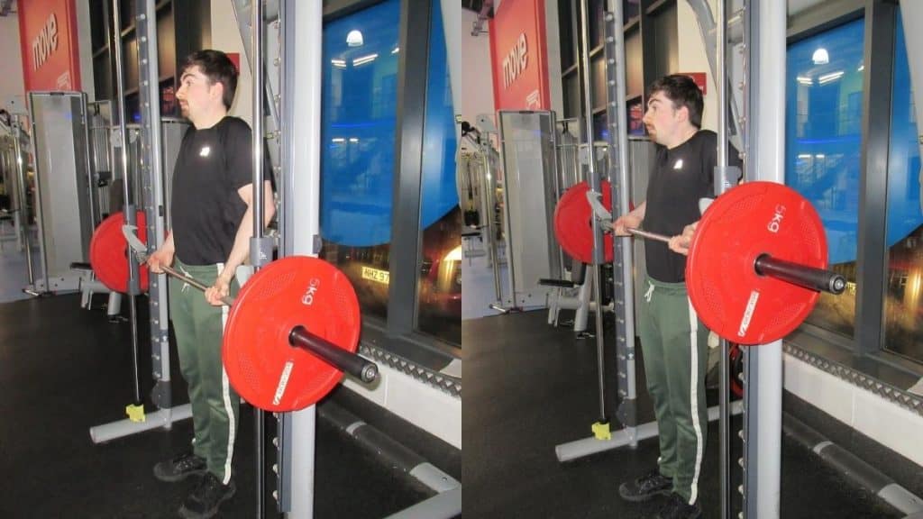 A man making a common Smith machine drag curl mistake: shrugging the weight up